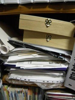 piles of genealogy paperwork for filing